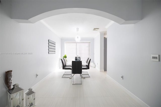 dining area with crown molding