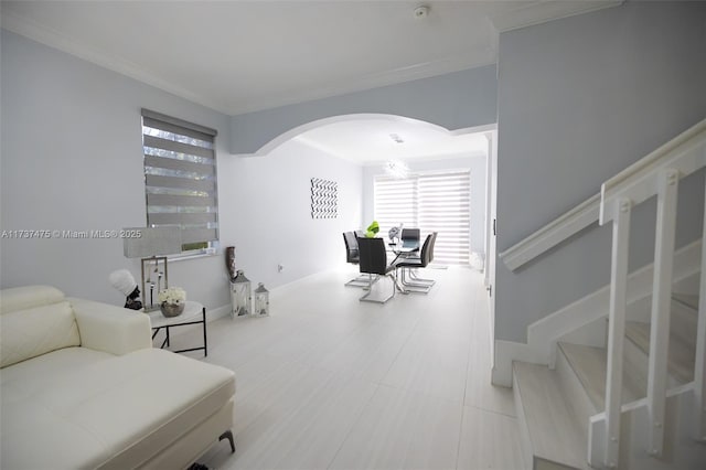 living room with ornamental molding