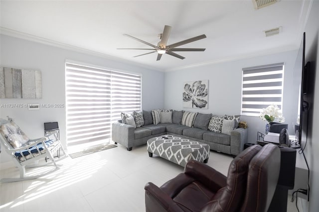 living room featuring ornamental molding and ceiling fan