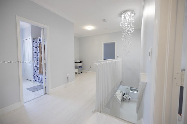 hallway with an inviting chandelier