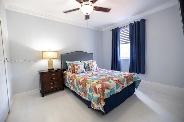 bedroom with ceiling fan and ornamental molding