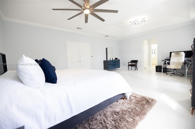 bedroom with a raised ceiling, crown molding, ceiling fan, and ensuite bath