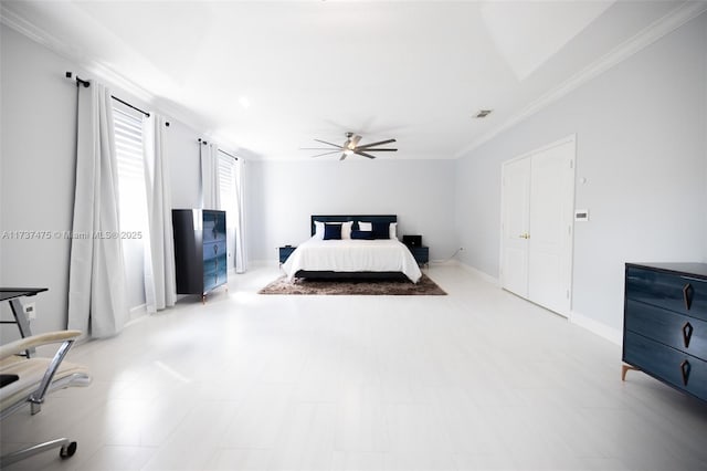 bedroom with crown molding and ceiling fan