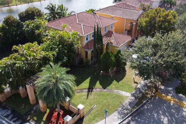 birds eye view of property with a water view