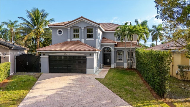 mediterranean / spanish-style house featuring a front lawn