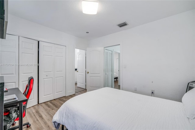 bedroom featuring light hardwood / wood-style floors and a closet