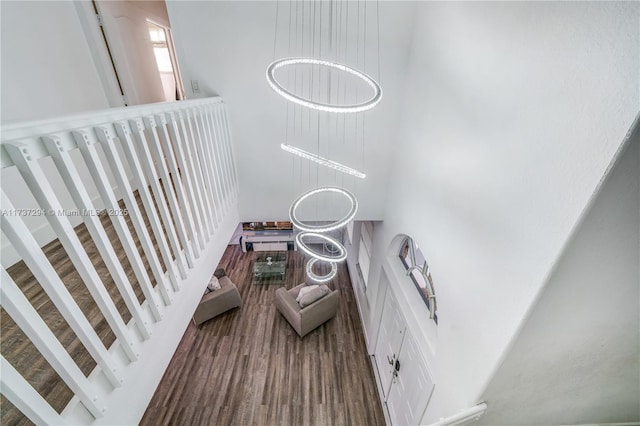 stairs featuring hardwood / wood-style floors