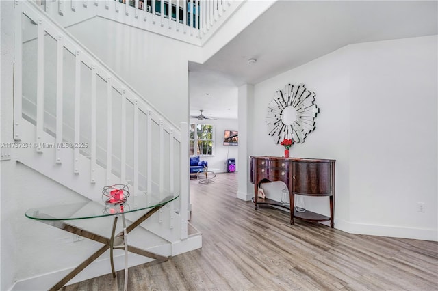 entrance foyer featuring hardwood / wood-style flooring and ceiling fan