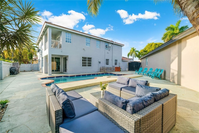 view of pool featuring an outdoor living space and a patio