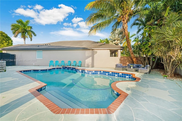 view of swimming pool featuring an outdoor living space and a patio