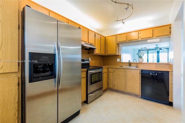 11312 Taft St Unit 11312, Pembroke Pines, FL 33026 - kitchen with appliances with stainless steel finishes, a sink, under cabinet range hood, light tile patterned flooring, and light countertops