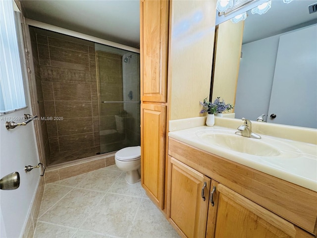 bathroom featuring vanity, tile patterned flooring, a shower with door, and toilet