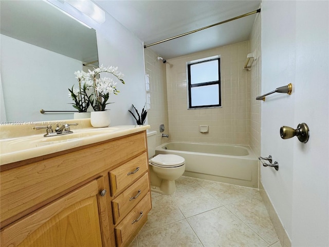 full bathroom featuring tile patterned flooring, vanity, toilet, and tiled shower / bath