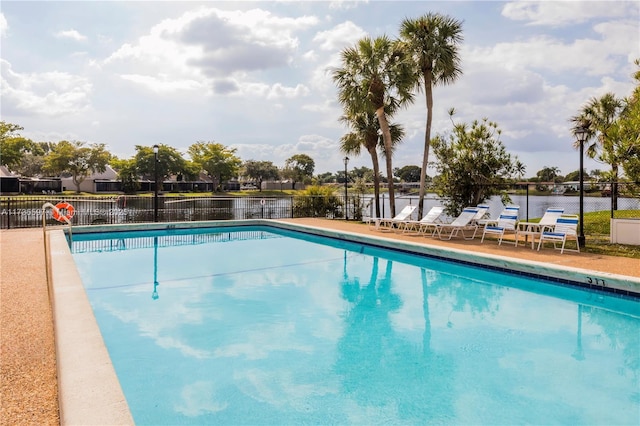 view of pool featuring a water view