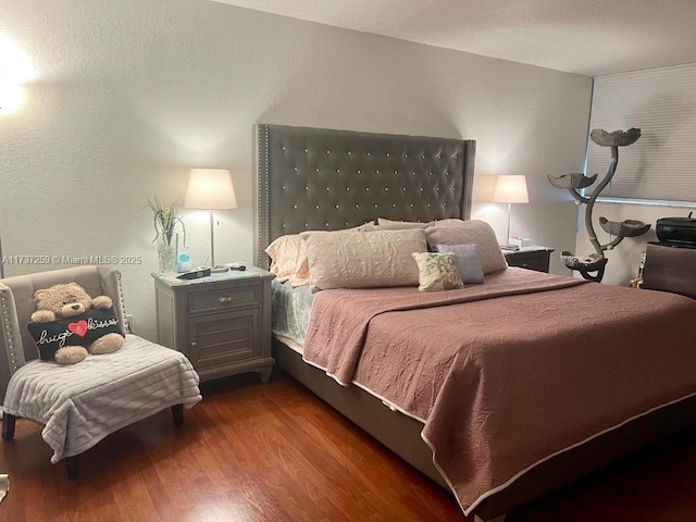 bedroom featuring dark hardwood / wood-style flooring