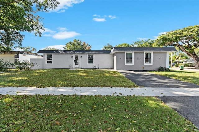 ranch-style house with a front lawn