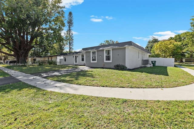 ranch-style home with a front yard