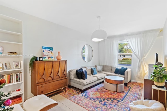 living room featuring light tile patterned floors and built in features