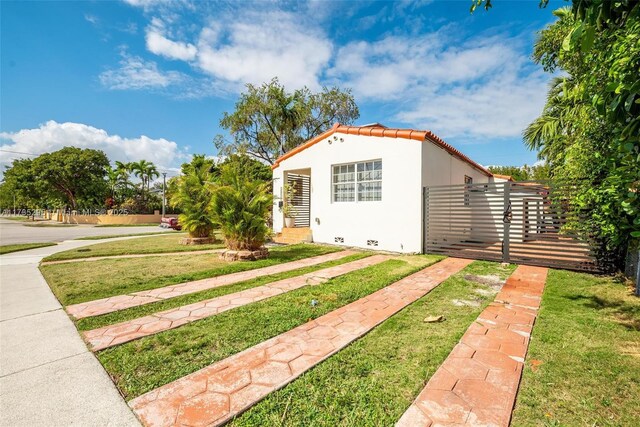 2039 SW 17th St, Miami, FL 33145 - view of front of home with stucco siding and a tiled roof