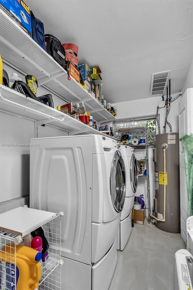 laundry area featuring separate washer and dryer and water heater