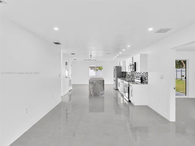 interior space with visible vents, recessed lighting, and a healthy amount of sunlight