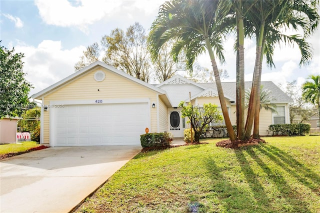 ranch-style house featuring a garage and a front yard