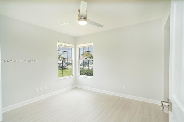 unfurnished room featuring ceiling fan and light wood-type flooring