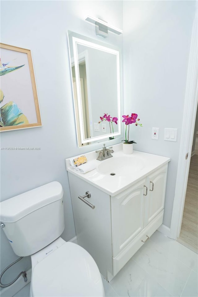 bathroom with vanity and toilet