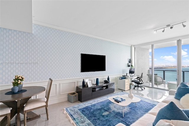 living room with expansive windows, ornamental molding, light tile patterned floors, and track lighting