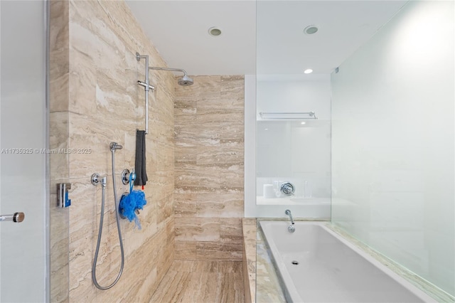 bathroom with shower with separate bathtub