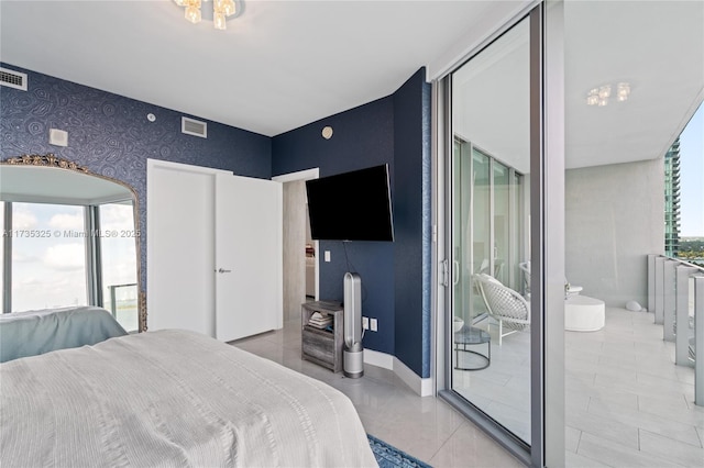 bedroom with multiple windows and tile patterned floors