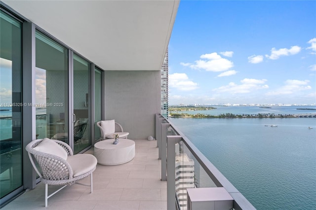 balcony featuring a water view