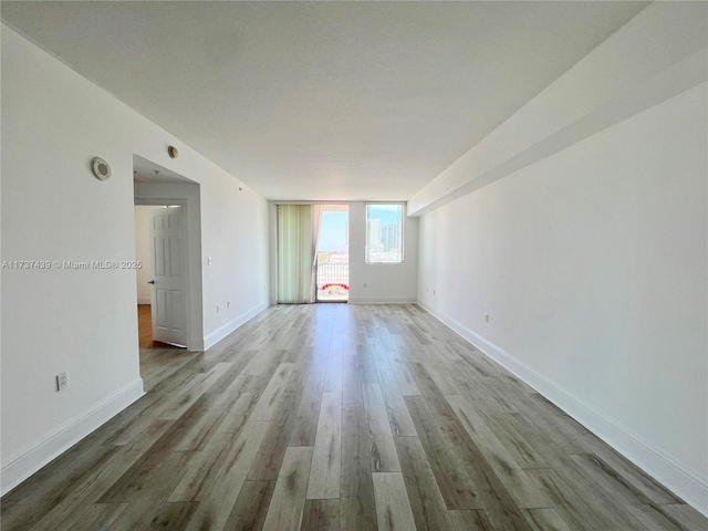 empty room featuring hardwood / wood-style flooring