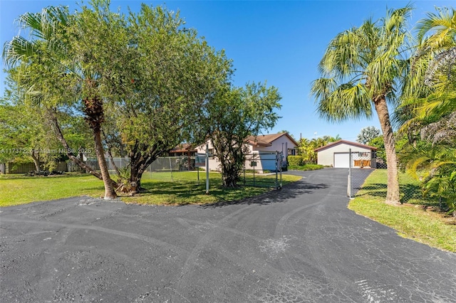 view of front of property with a garage and a front yard