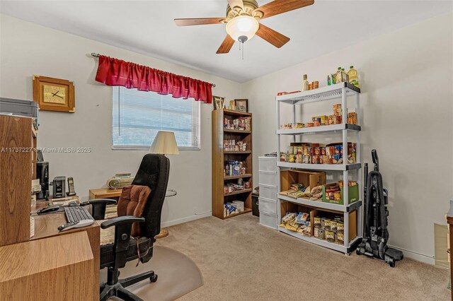 office space with light carpet and ceiling fan