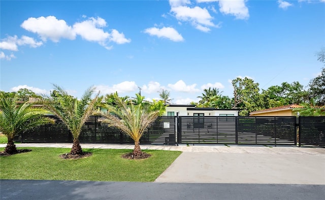 view of gate featuring a lawn