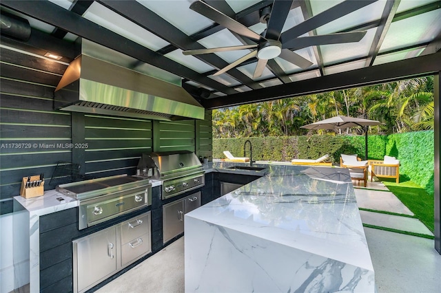 view of patio / terrace with area for grilling, sink, and ceiling fan