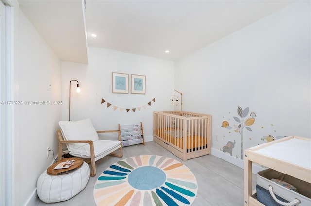 bedroom with a nursery area