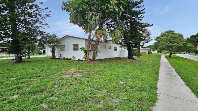 view of home's exterior with a lawn