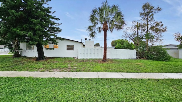 view of home's exterior featuring a yard