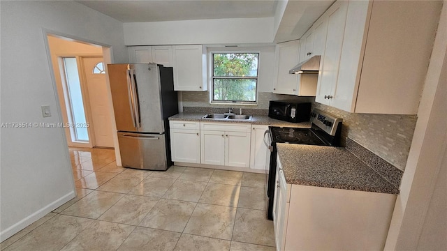 kitchen with light tile patterned flooring, white cabinetry, sink, backsplash, and stainless steel appliances