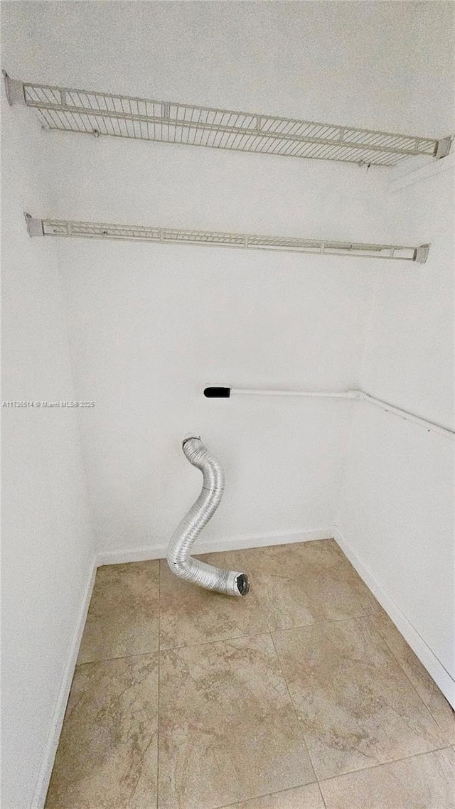 laundry area featuring tile patterned floors