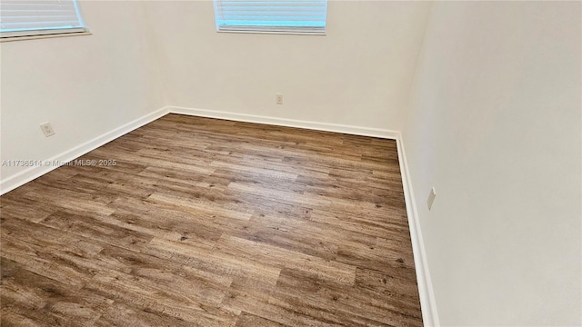 unfurnished room featuring dark hardwood / wood-style flooring