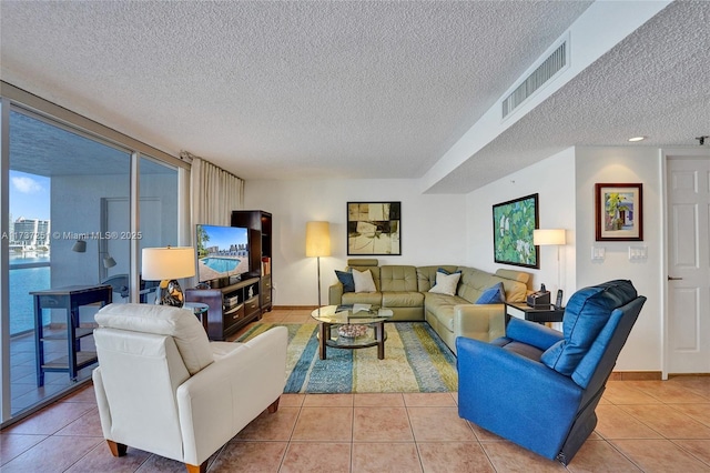 tiled living room with a textured ceiling