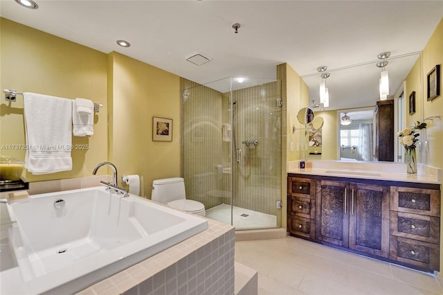 full bathroom featuring tile patterned floors, toilet, separate shower and tub, and vanity