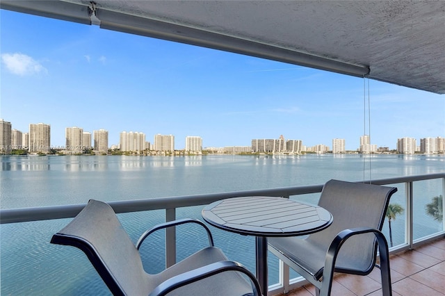 balcony featuring a water view