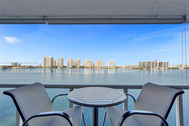 balcony featuring a water view