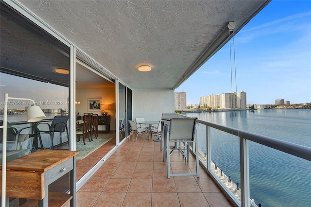 balcony featuring a water view