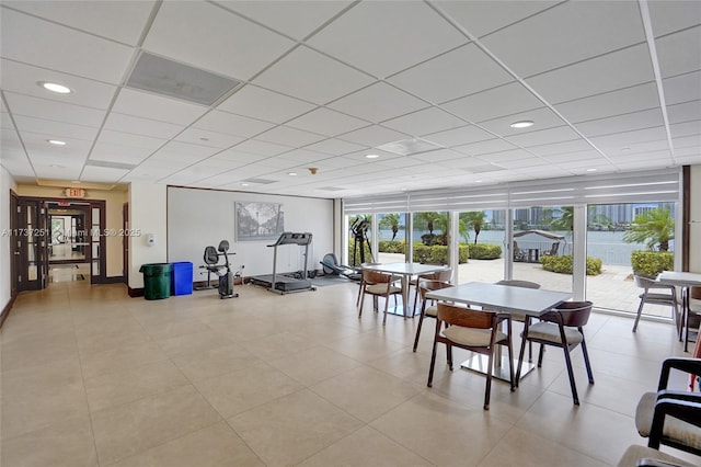 exercise room with a paneled ceiling