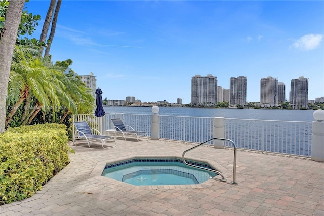 view of pool featuring a community hot tub and a patio